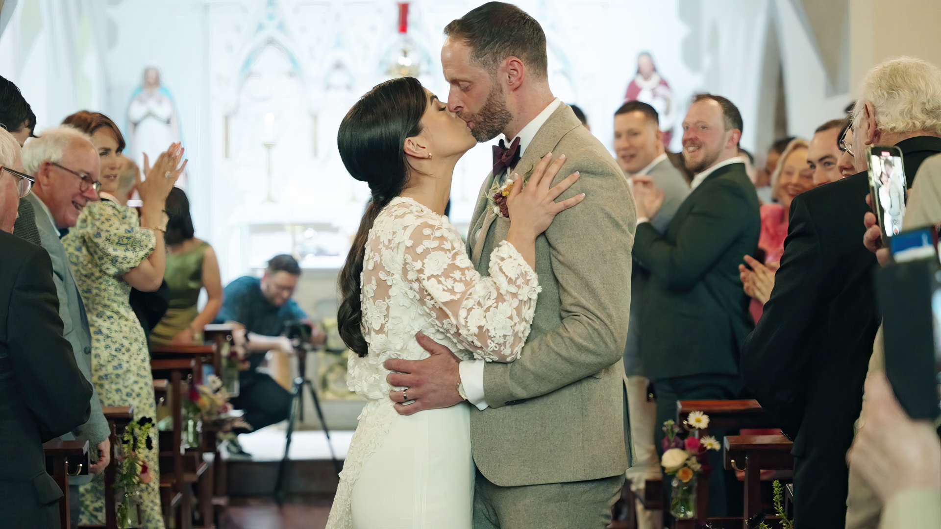 A couple share their first kiss on their wedding day in the chapel